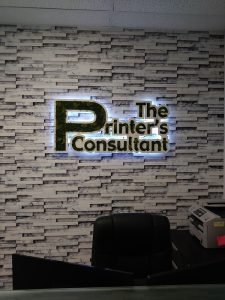 Picture of sign with plants for The Printers Consultant